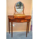 A DRESSING TABLE together with an oval mirror. (2)