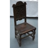 A 17TH/18TH CENTURY ENGLISH OAK HALL/SIDE CHAIR with floral and portrait cartouche.