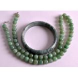 A CHINESE REPUBLICAN PERIOD CARVED JADEITE BANGLE together with a necklace. (2)