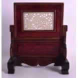 A 19TH CENTURY CHINESE CARVED WOOD SCHOLARS SCREEN ON STAND inset with a green jade panel of a