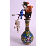 A CHINESE CLOISONNE ENAMEL MINIATURE VASE C1950 decorated with flowers. 6.75ins high.