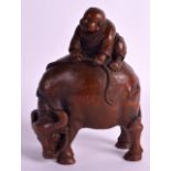 A 19TH CENTURY CHINESE CARVED BAMBOO FIGURE OF AN OXEN modelled with a young boy upon its back. 5Ins