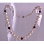 A LADIES 18CT WHITE GOLD PEARL AND RUBY NECKLACE.