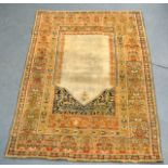 A LOVELY SILK CARPET depicting foliage upon a beige ground. 5Ft 8ins x 4ft.