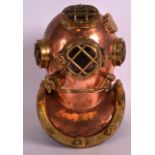 AN EARLY 20TH CENTURY COPPER AND BRASS DIVERS HELMET of small proportions. 10Ins high.