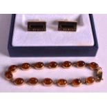 A VINTAGE 9CT GOLD AND BALTIC AMBER BRACELET together with a pair of boxed Givenchy cufflinks. (2)