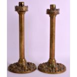 A PAIR OF LATE 19TH CENTURY FRENCH BRASS CANDLESTICKS with leaf and scrolling foliage, bearing