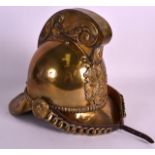 A LATE VICTORIAN BRASS FIREMANS HELMET with central panel decorated with axes and a flaming torch.