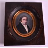 AN EARLY 19TH CENTURY CONTINENTAL PAINTED PORTRAIT IVORY MINIATURE depicting a male wearing a
