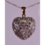A 9CT GOLD AND DIAMOND HEART NECKLACE.