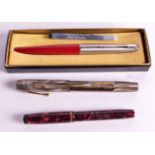 A WATERMANS MARBLE EFFECT FOUNTAIN PEN together with a 14ct nib pen & another parker pen. (3)