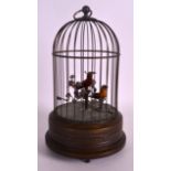 AN EARLY 20TH CENTURY FRENCH AUTOMATON BIRD CAGE modelled with two birds upon foliate stumps, the