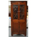 A LARGE ANTIQUE OAK CORNER CABINET with glass fronted doors. 6Ft 8ins x 3ft 2ins.