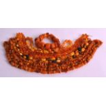 AN EARLY 20TH CENTURY CARVED AMBER BRACELET together with four other necklaces including crushed