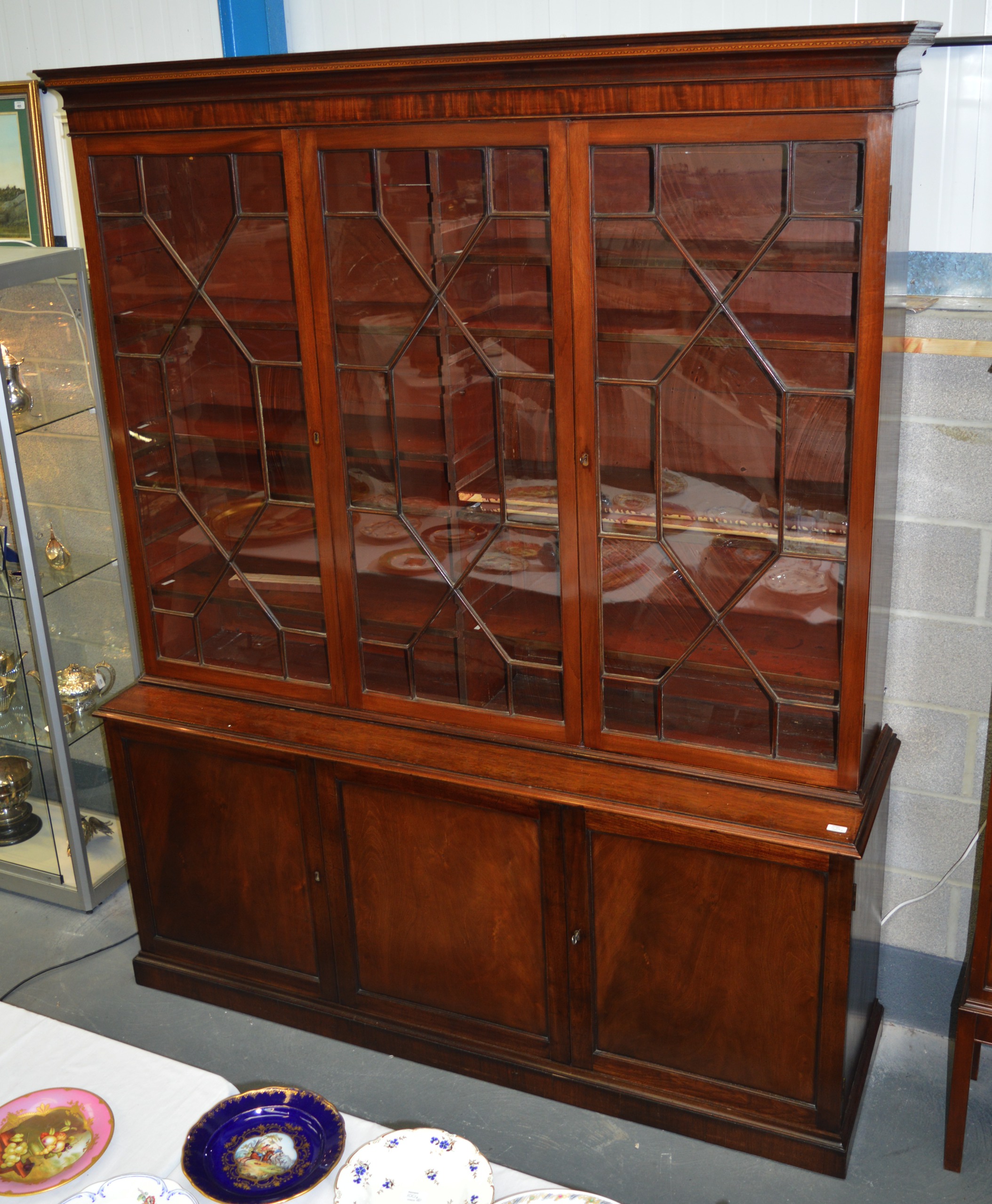 A VERY LARGE GEORGE III MAHOGANY DISPLAY CASE with glass doors and base with cupboard doors. 6Ft