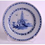 AN 18TH CENTURY DELFT POTTERY PLATE painted with a hut on an island. 8.75ins diameter.