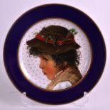 A LATE 19TH CENTURY CONTINENTAL CABINET PLATE painted with a portrait of a boy within a cobalt