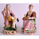 A PAIR OF 19TH CENTURY DERBY FIGURES OF A BOY AND GIRL modelled seated upon scrolling gilt bases.