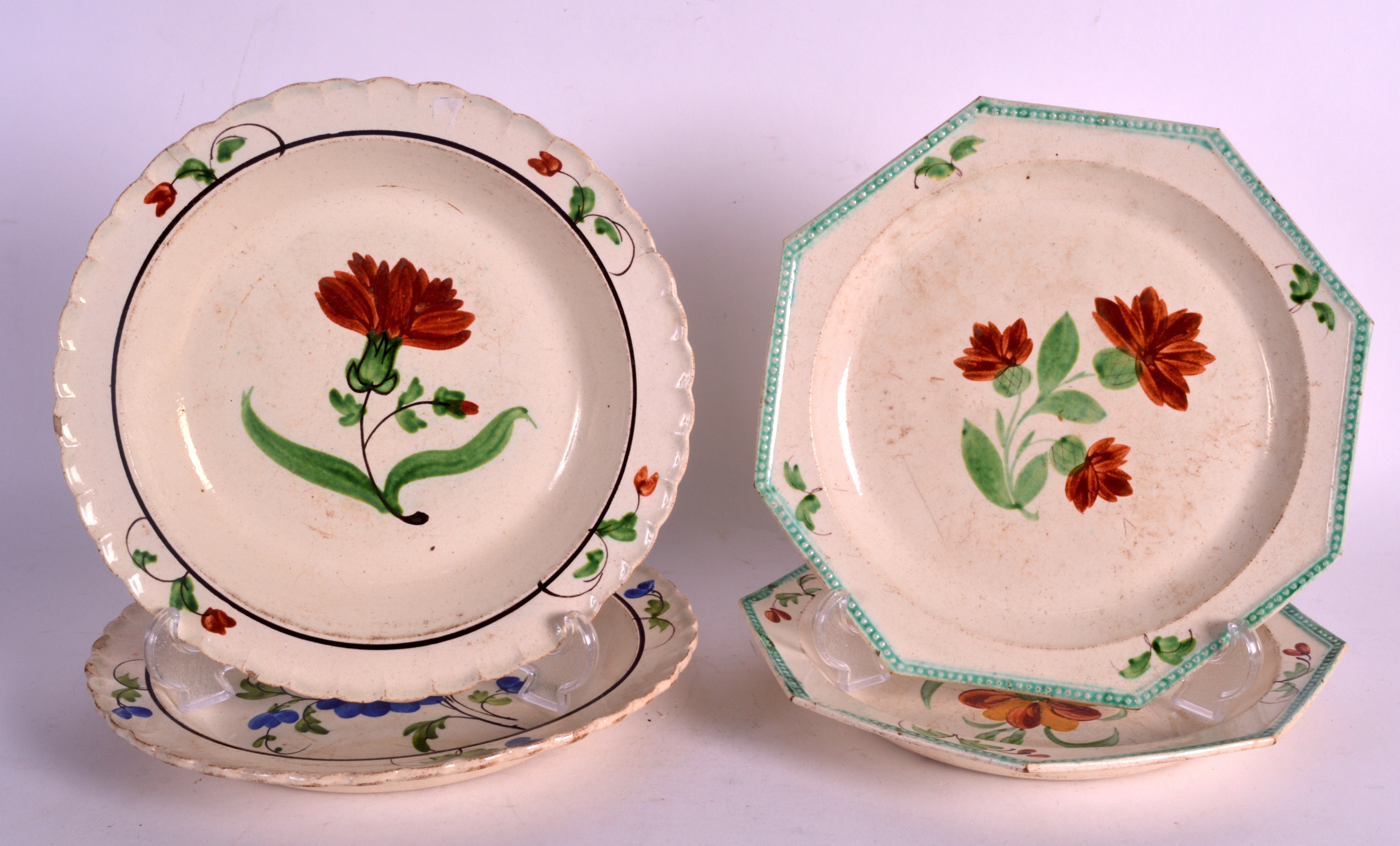 A PAIR OF 18TH/19TH CENTURY CREAMWARE OCTAGONAL PLATES together with two similar dishes. 8.5ins