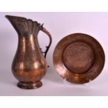 AN 18TH/19TH CENTURY ISLAMIC TINNED COPPER JUG AND BASIN engraved all over with flowers. Jug 1ft 2.