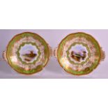 A PAIR OF COALPORT PORCELAIN PLATES painted with titled landscapes, one signed by A Perry, under a