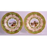 A PAIR OF COALPORT PORCELAIN PLATES painted with titled landscapes, one signed by A Perry, under a