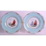 A PAIR OF ROYAL CROWN DERBY PORCELAIN PLATES painted with boats by W Dean under a blue border. 8.