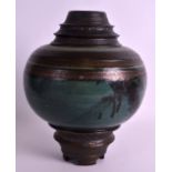 AN UNUSUAL RETRO STUDIO POTTERY VASE of bulbous form, with incised triple rim. Signed. 10.75ins