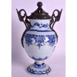 AN 18TH CENTURY ITALIAN BLUE AND WHITE DRUG JAR with pewter mounts, painted with flowers, the