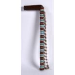 AN EARLY 20TH CENTURY NORTH AMERICAN BEAD WORK STAFF. 1Ft 1ins long.