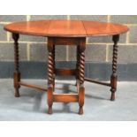 AN OAK DROP LEAF TABLE. 3Ft 10ins extended.