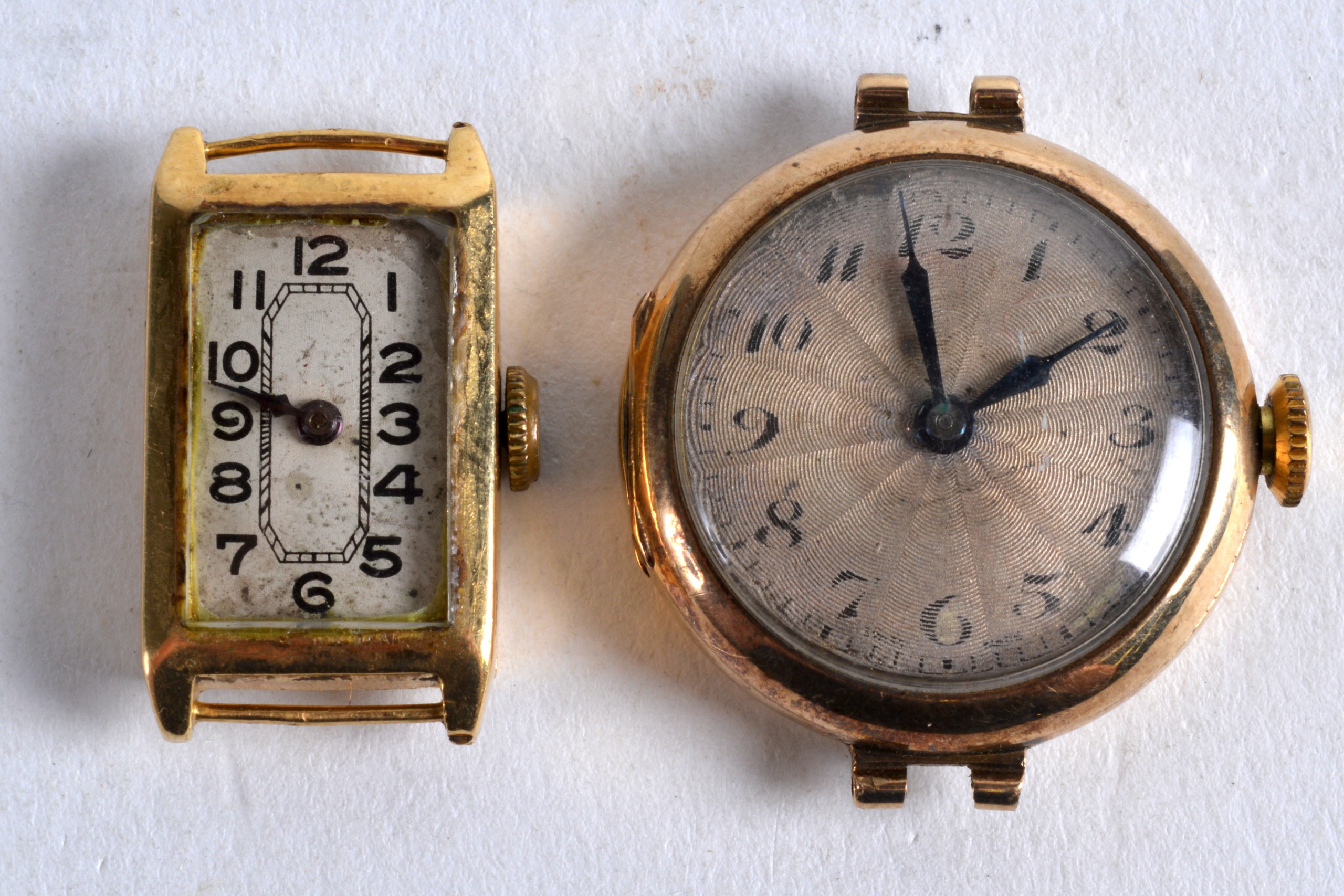 A 9CT YELLOW GOLD LADIES WATCH FACE together with an 18ct yellow gold watch face. (2)