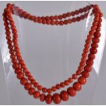 A FINE EARLY 20TH CENTURY CHINESE RED CORAL NECKLACE Qing/Republic, of graduated form and of