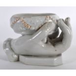 A MID 19TH CENTURY FRENCH PORCELAIN TABLE SALT in the form of an open hand, with overlaid bead