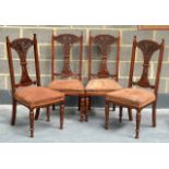 A SET OF FOUR VICTORIAN MAHOGANY DINING CHAIRS with brown upholstery. (4)