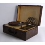 A 1950S LEATHER CASED DECCA TRAVELLING RECORD PLAYER. 1Ft 3ins wide.