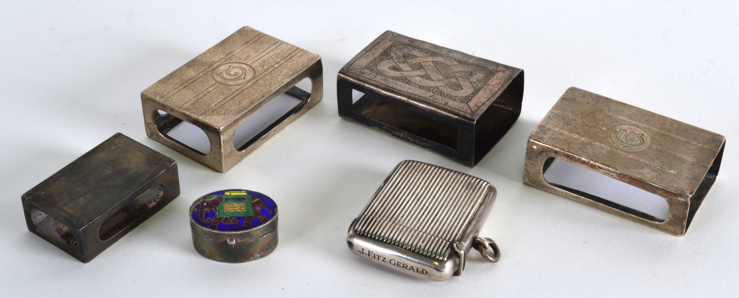 A GROUP OF FOUR SILVER MATHCBOX CASES together with a silver vesta case & a silver box. (6)