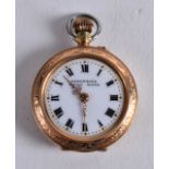 AN EDWARDIAN 9CT YELLOW GOLD AND ENAMEL FOB WATCH. 1.25ins diameter.