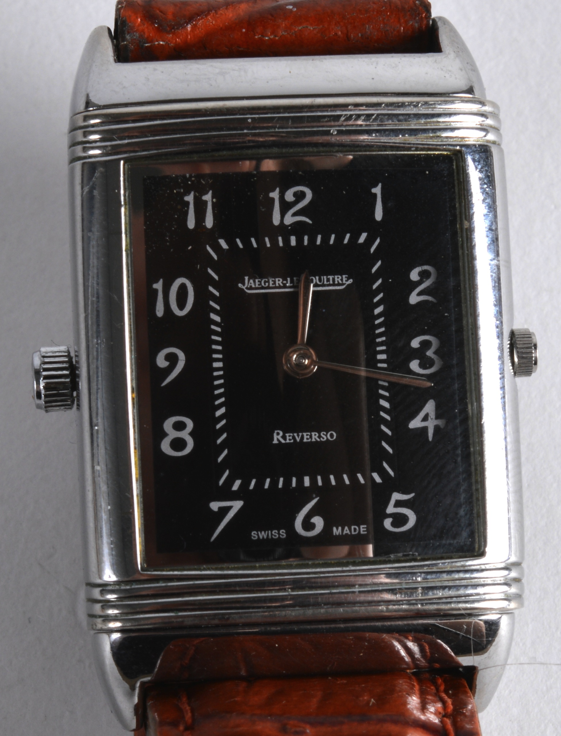 A VINTAGE JAEGAR LE COULTRE GENTLEMANS REVERSO WRISTWATCH with swivel dial and leather strap. Dial