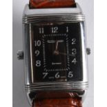 A VINTAGE JAEGAR LE COULTRE GENTLEMANS REVERSO WRISTWATCH with swivel dial and leather strap. Dial