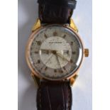 A 1950S GENTLEMANS MOVADO YELLOW METAL GENTLEMANS WRISTWATCH with brown leather strap. 1.5ins