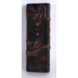 A LARGE CHINESE CARVED BLACK INKBLOCK Republic, decorated with dragons and crashing waves. 8.25ins