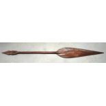 A LARGE MID 20TH CENTURY CARVED HARDWOOD TRIBAL PADDLE & SPEAR. 5Ft 1ins long.