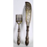 A PAIR OF VICTORIAN SILVER FISH SERVERS with silver blades, engraved all over with foliage.