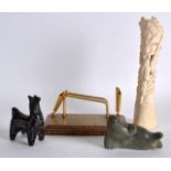 AN EARLY 20TH CENTURY INDIAN CARVED BONE FIGURE together with an inuit figure, a persian ink stand