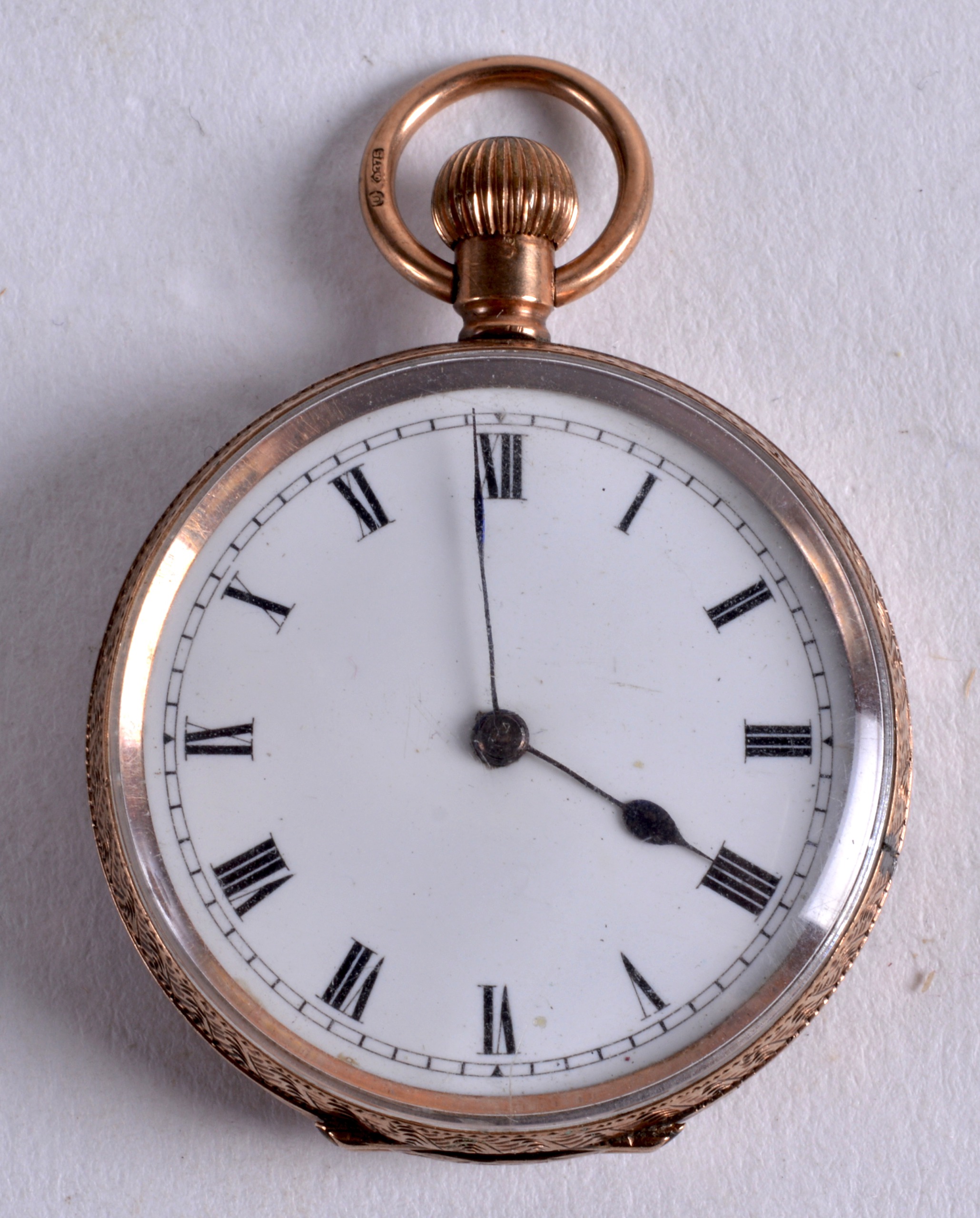 A 9CT LADIES GOLD FOB WATCH. 1.25ins diameter.