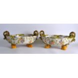 A LARGE PAIR OF 19TH CENTURY FAIENCE OVAL BOWLS by Cantagalli, painted with scrolling foliage and