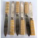 AN UNUSUAL SET OF VICTORIAN MAMMOTH TOOTH AND SILVER PLATED KNIVES with entwined monogram. (6)