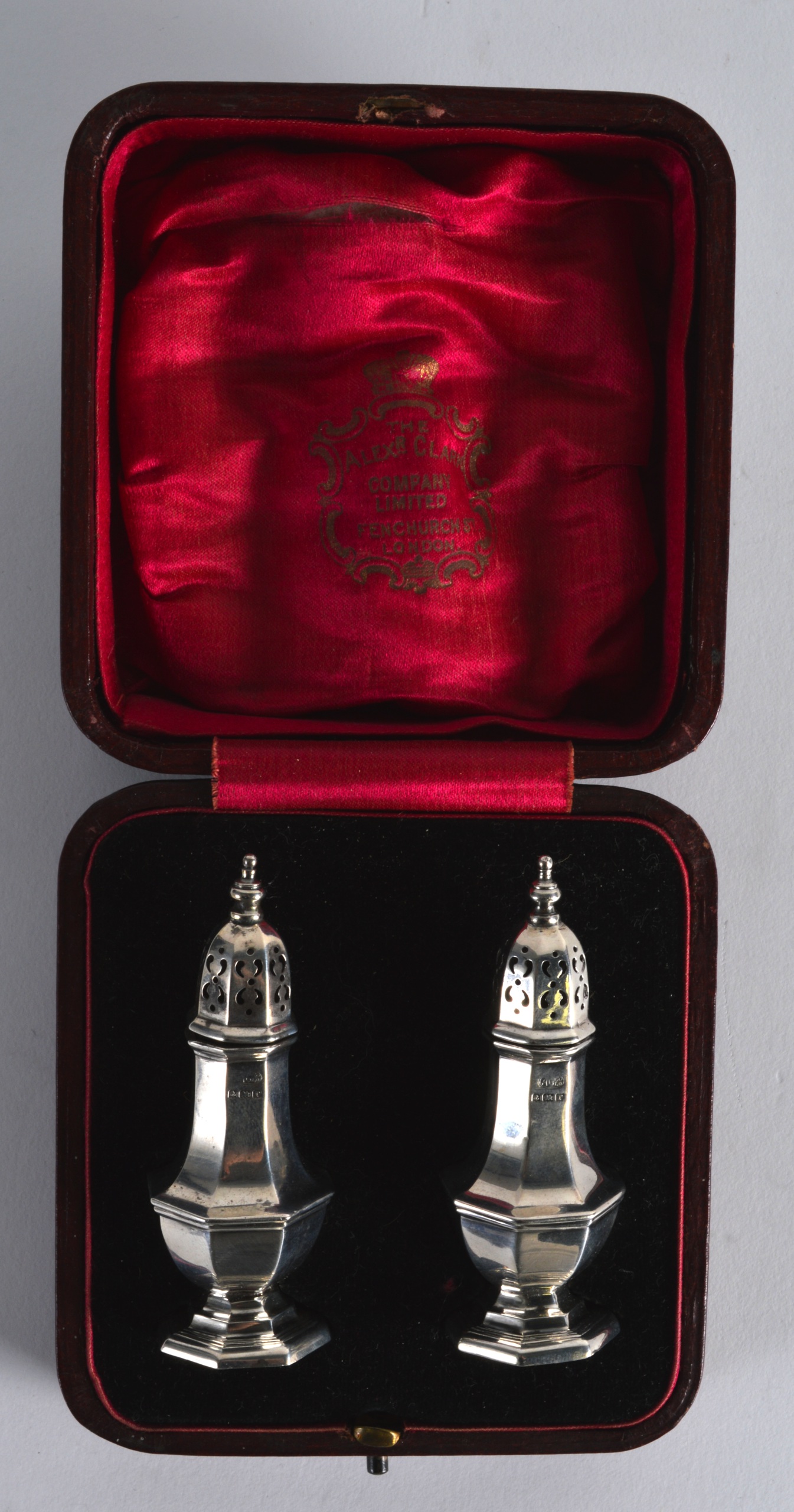 A PAIR OF CASED SILVER PEPPERETTES. Birmingham 1916.