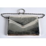 A NOVELTY EDWARDIAN SILVER PURSE in the form of an envelope. Chester 1913. 4.25ins wide.